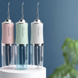 Water flosser in white, mint green and pink